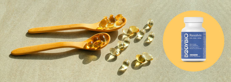 Blog of Fish Oil+ Is Now Resolvin — Here’s Why That Matters for Inflammation and Recovery which have image BodyBio Resolvin supplement with softgels on wooden spoons
